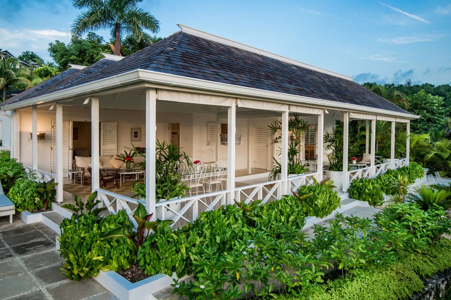 Classic Villa exterior with wraparound veranda at Round Hill Hotel And Villas.