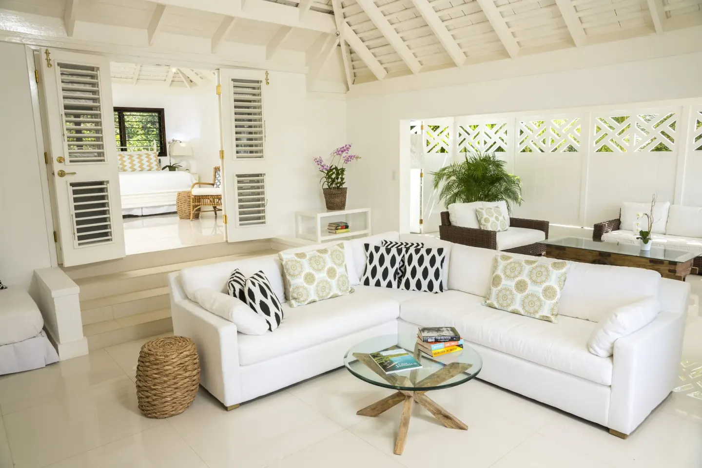 White villa living room with sofa and sitting area at Round Hill Hotel And Villas.