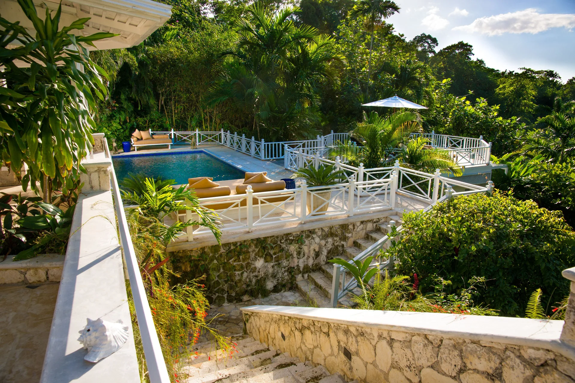 Classic Villa private pool terrace surrounded by tropical gardens at Round Hill Hotel And Villas.