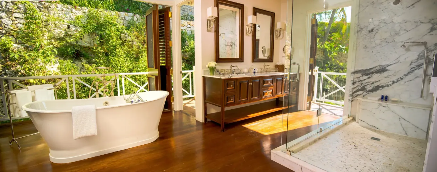 Open bathroom with soaking tub in Estate Villa 5 Bedroom at Round Hill Hotel And Villas.