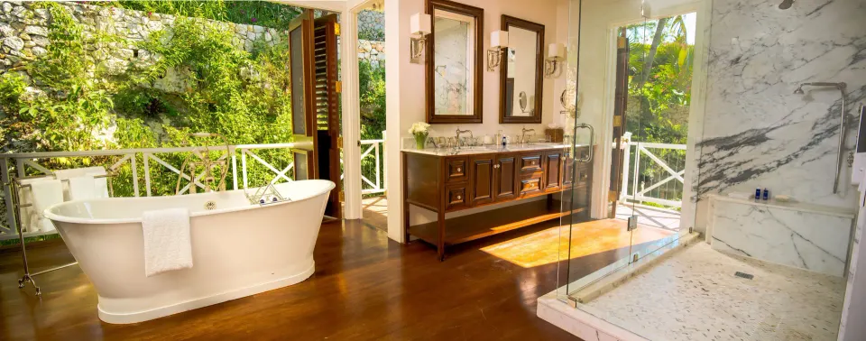 Open bathroom with soaking tub in Estate Villa 5 Bedroom at Round Hill Hotel And Villas.