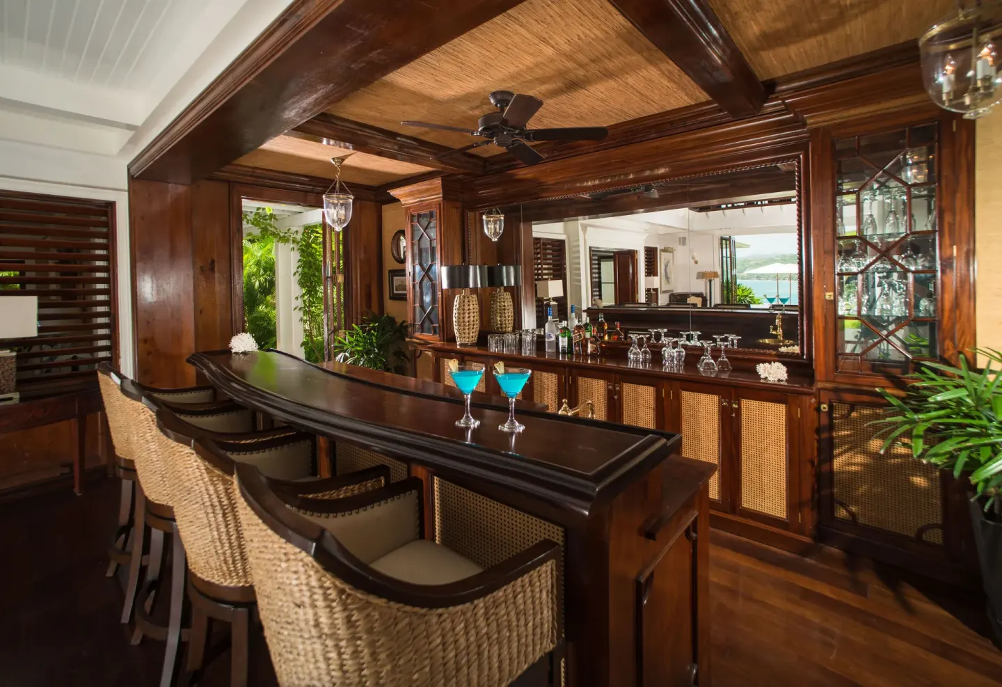Estate Villa 5 Bedroom private bar with woven stools at Round Hill Hotel And Villas.