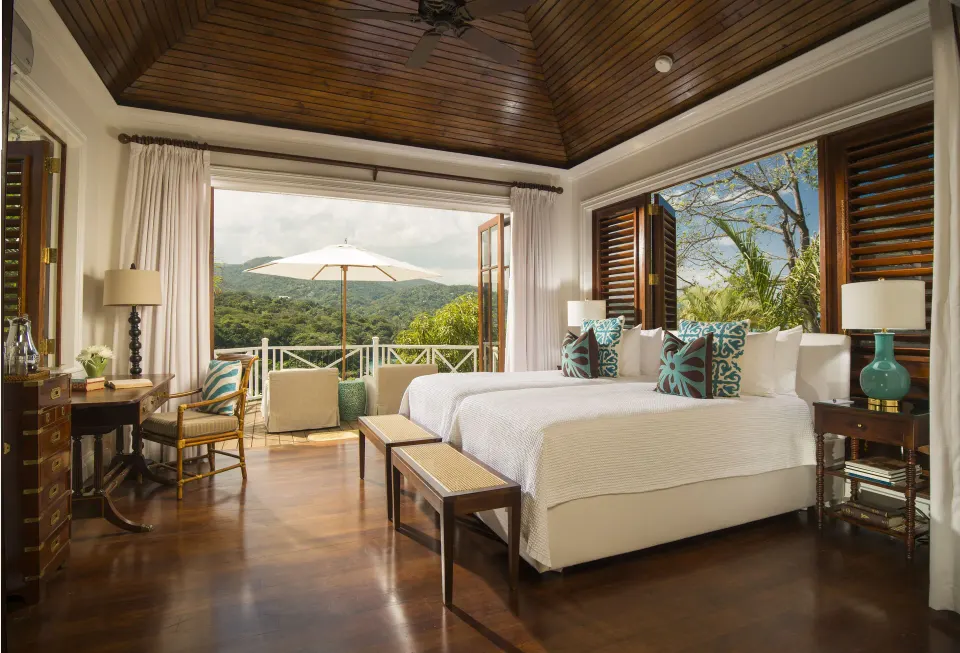 Twin-bed bedroom with balcony view in Estate Villa 5 Bedroom at Round Hill Hotel And Villas.