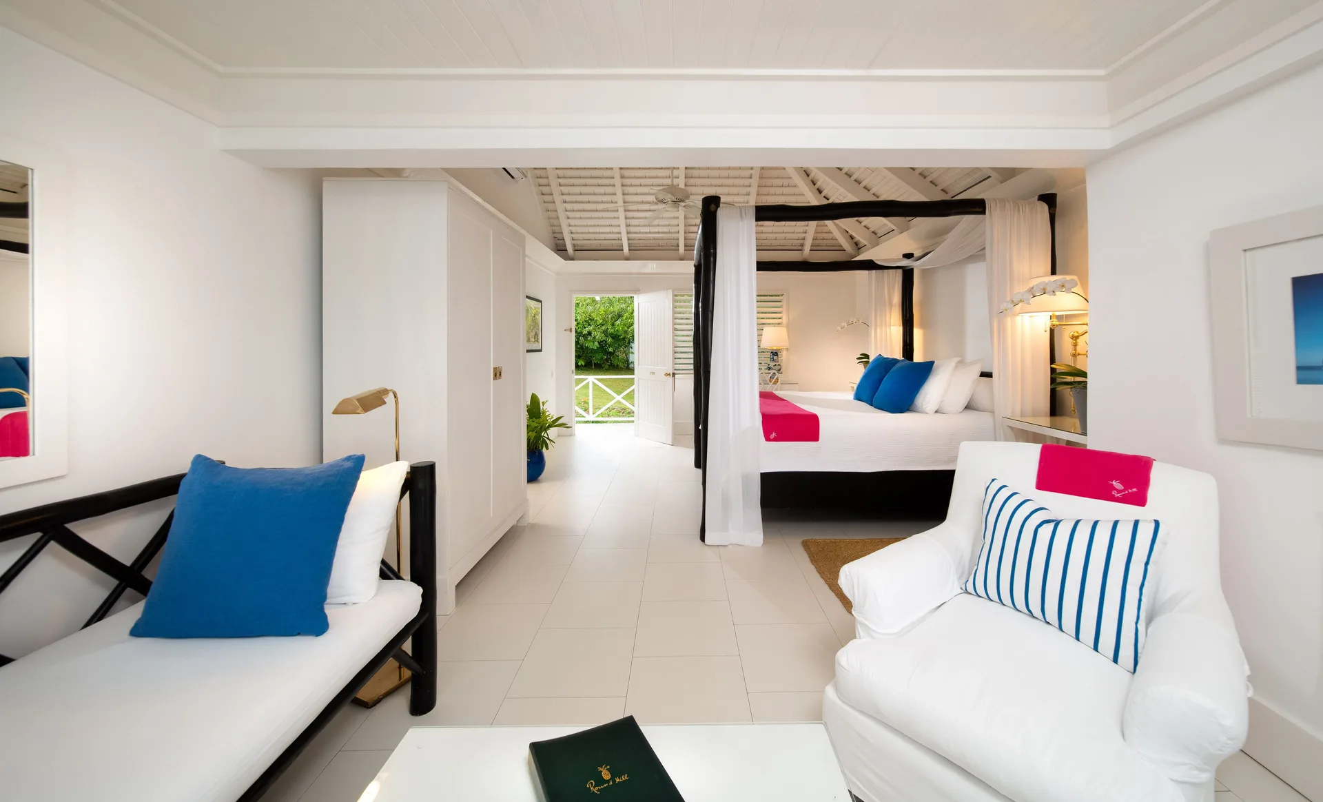 Premium Room Ocean View with canopy bed and sitting area at Round Hill Hotel And Villas.