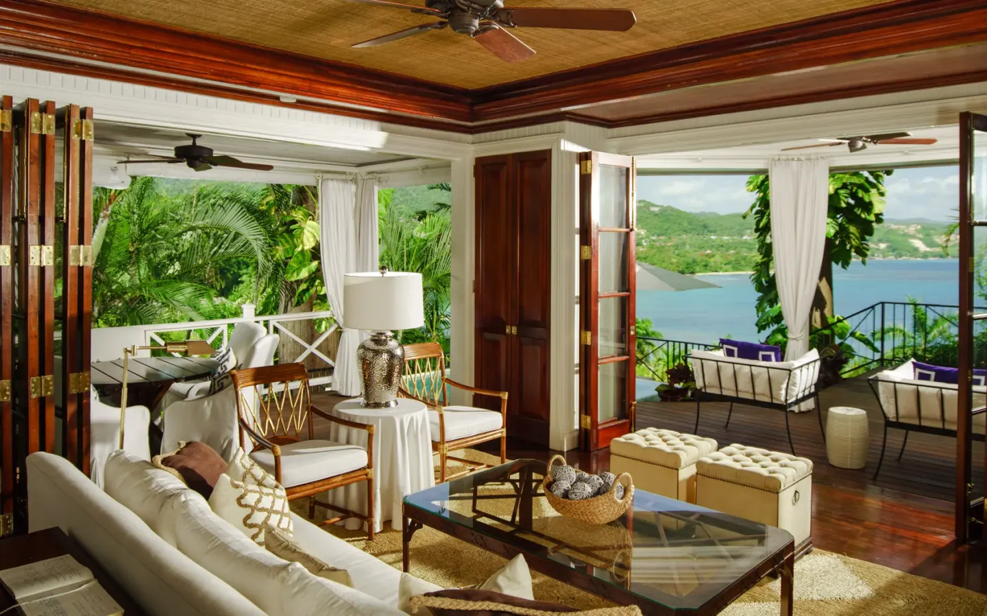 Ocean View room sitting area and terraces at Round Hill Hotel And Villas overlooking the bay.