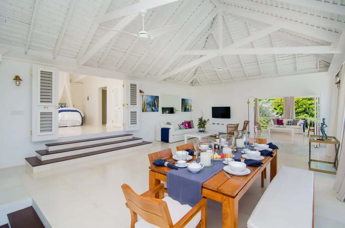Open living and dining area inside a Signature Villa at Round Hill Hotel And Villas.