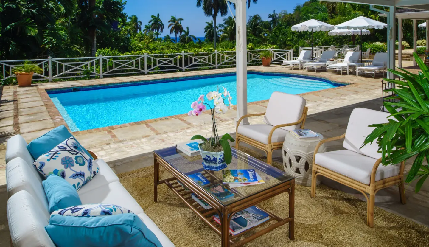Covered poolside lounge beside a private pool at Round Hill Hotel And Villas.