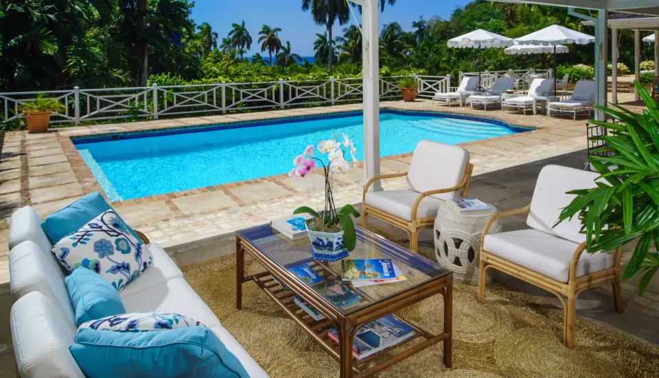 Covered poolside lounge beside a private pool at Round Hill Hotel And Villas.