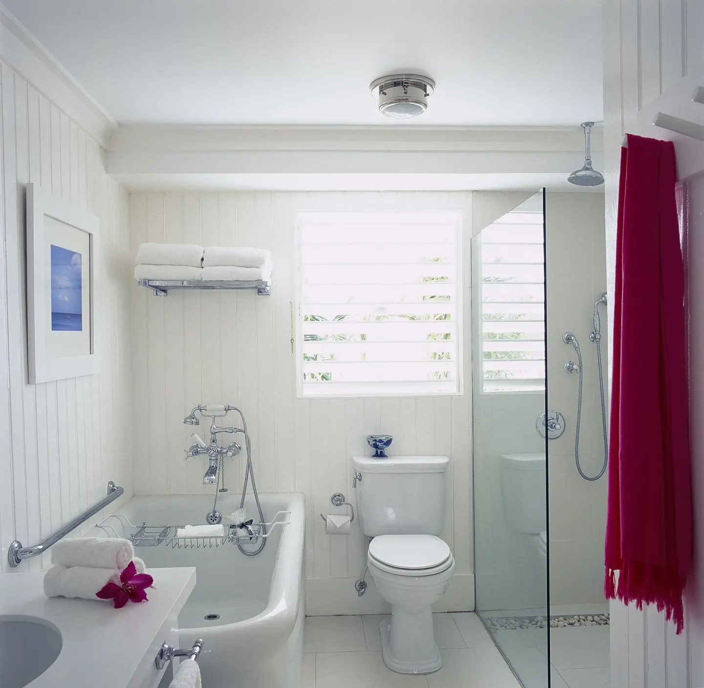 Standard Oceanfront Room bathroom with tub and shower at Round Hill Hotel And Villas.