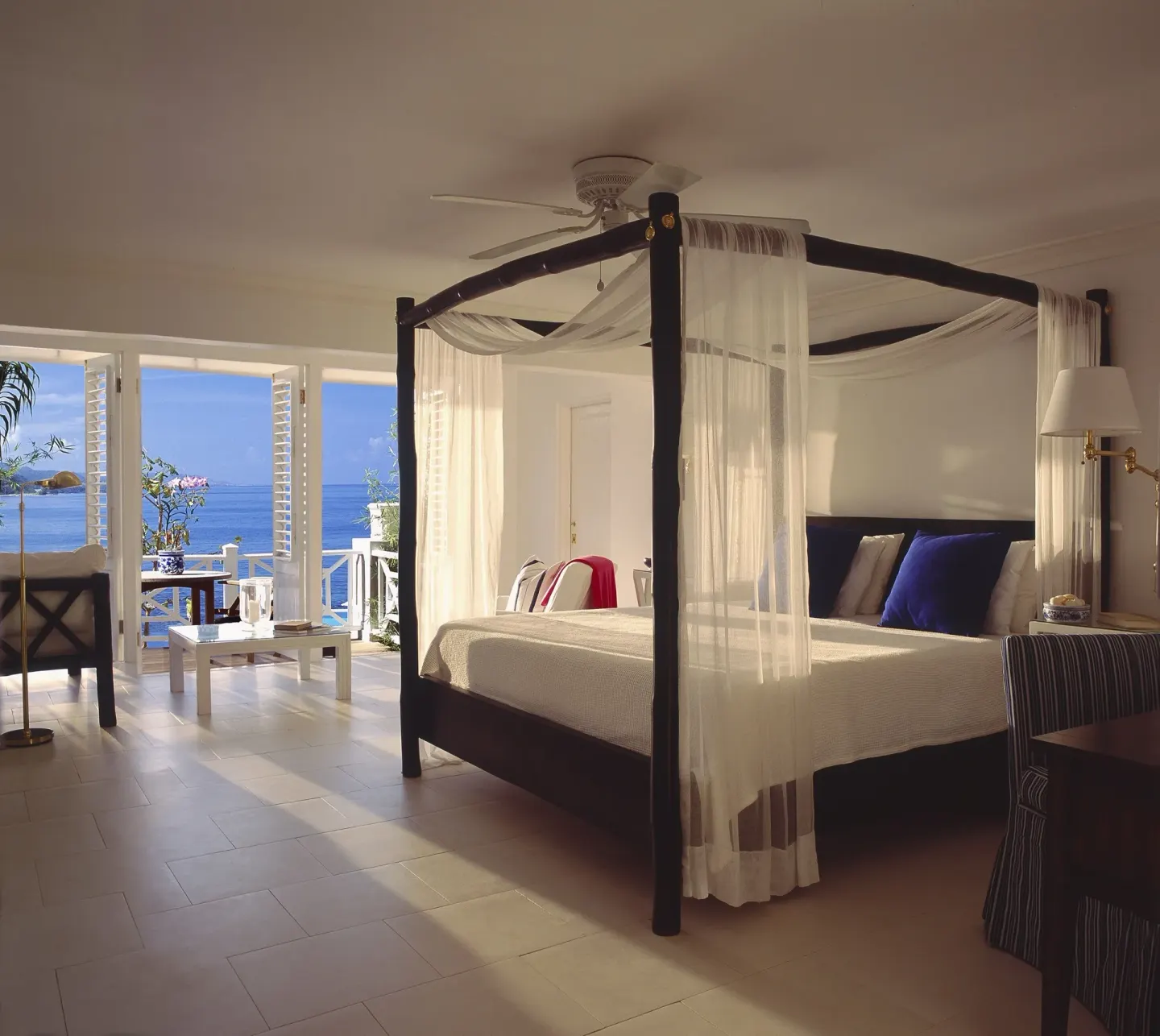 Standard Oceanfront Room with four-poster bed and open balcony at Round Hill Hotel And Villas.
