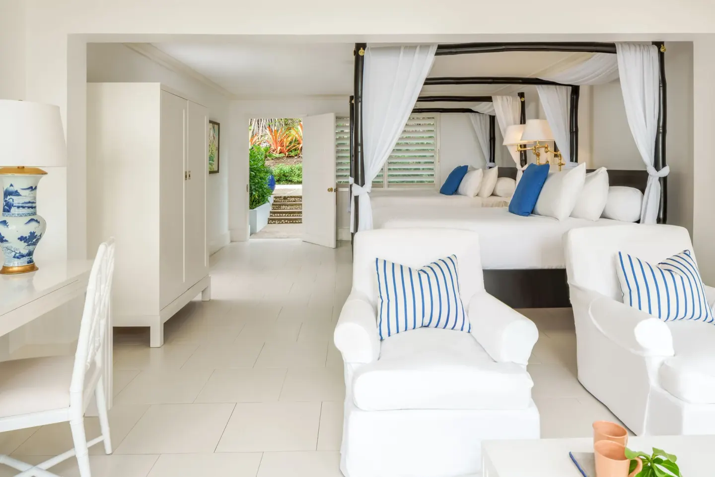 Standard Oceanfront Room with twin four-poster beds at Round Hill Hotel And Villas.
