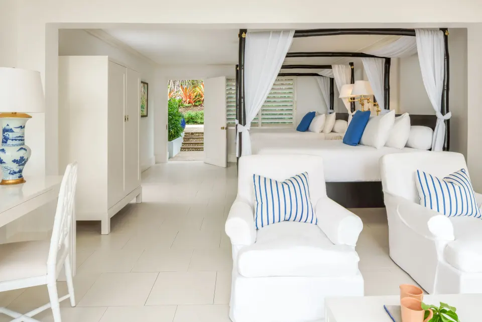 Standard Oceanfront Room with twin four-poster beds at Round Hill Hotel And Villas.
