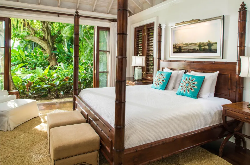Four-poster bed in a one-bedroom ocean view suite at Round Hill Hotel And Villas.
