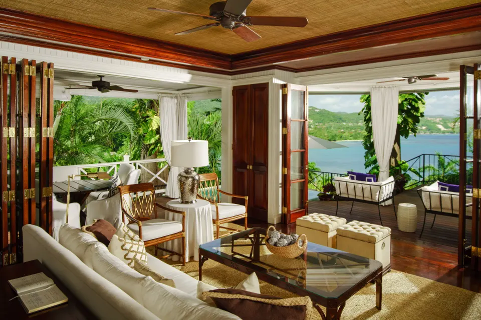 Ocean view suite living room with terrace seating at Round Hill Hotel And Villas.
