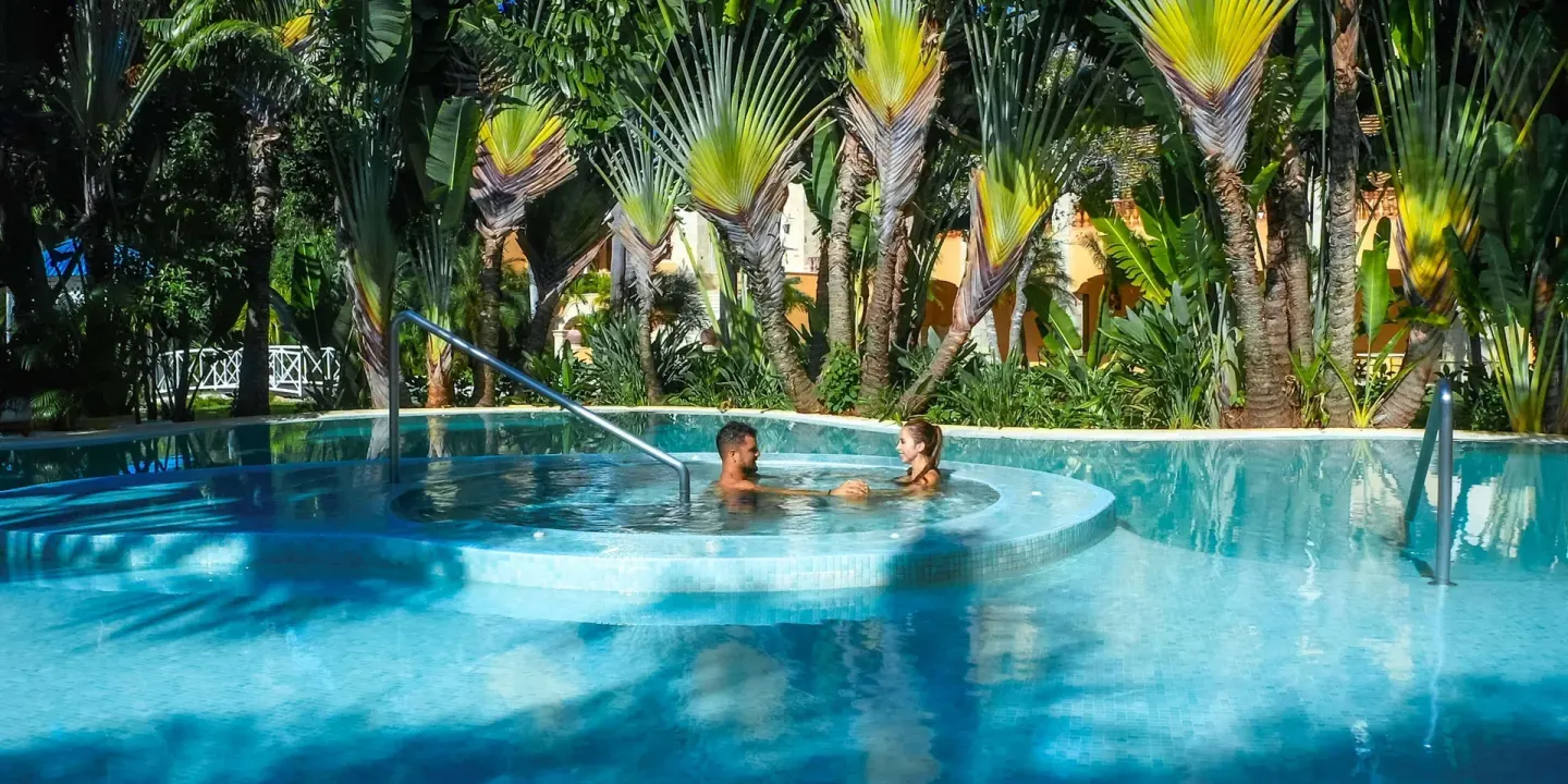 Garden pool with raised whirlpool area at Royal Hideaway Playacar.