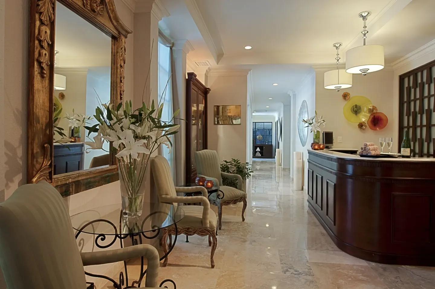 Elegant lobby seating area and reception counter at Royal Hideaway Playacar.