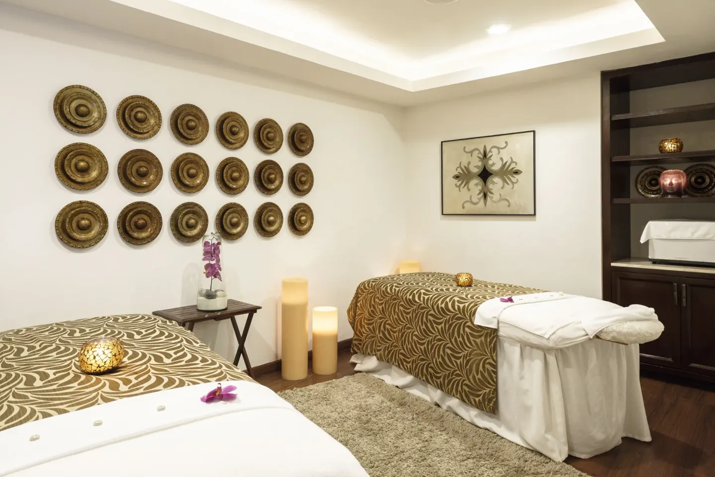 Spa treatment room with two massage tables at Royal Hideaway Playacar.