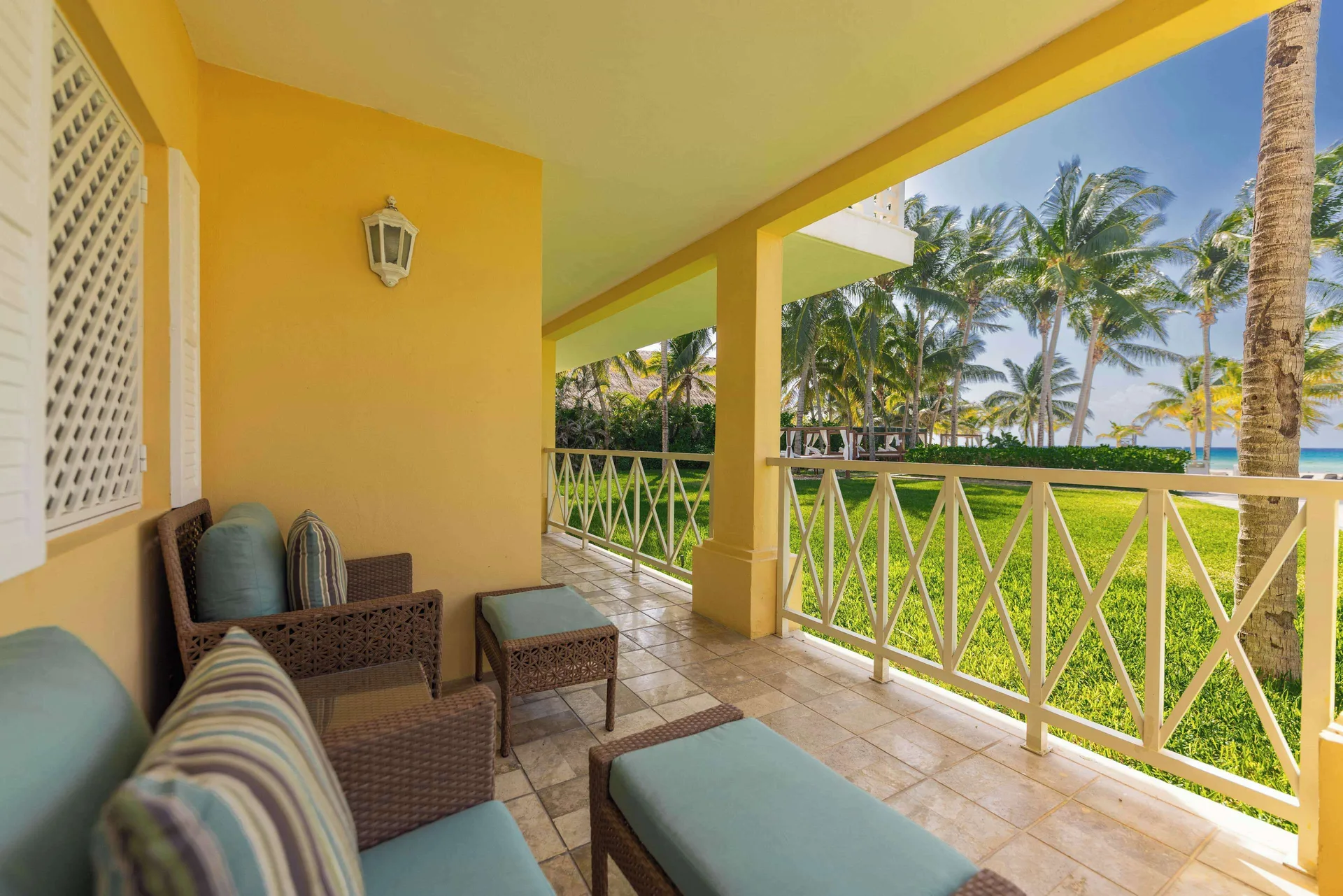 Furnished Luxury Room terrace with palms and ocean view at Royal Hideaway Playacar.