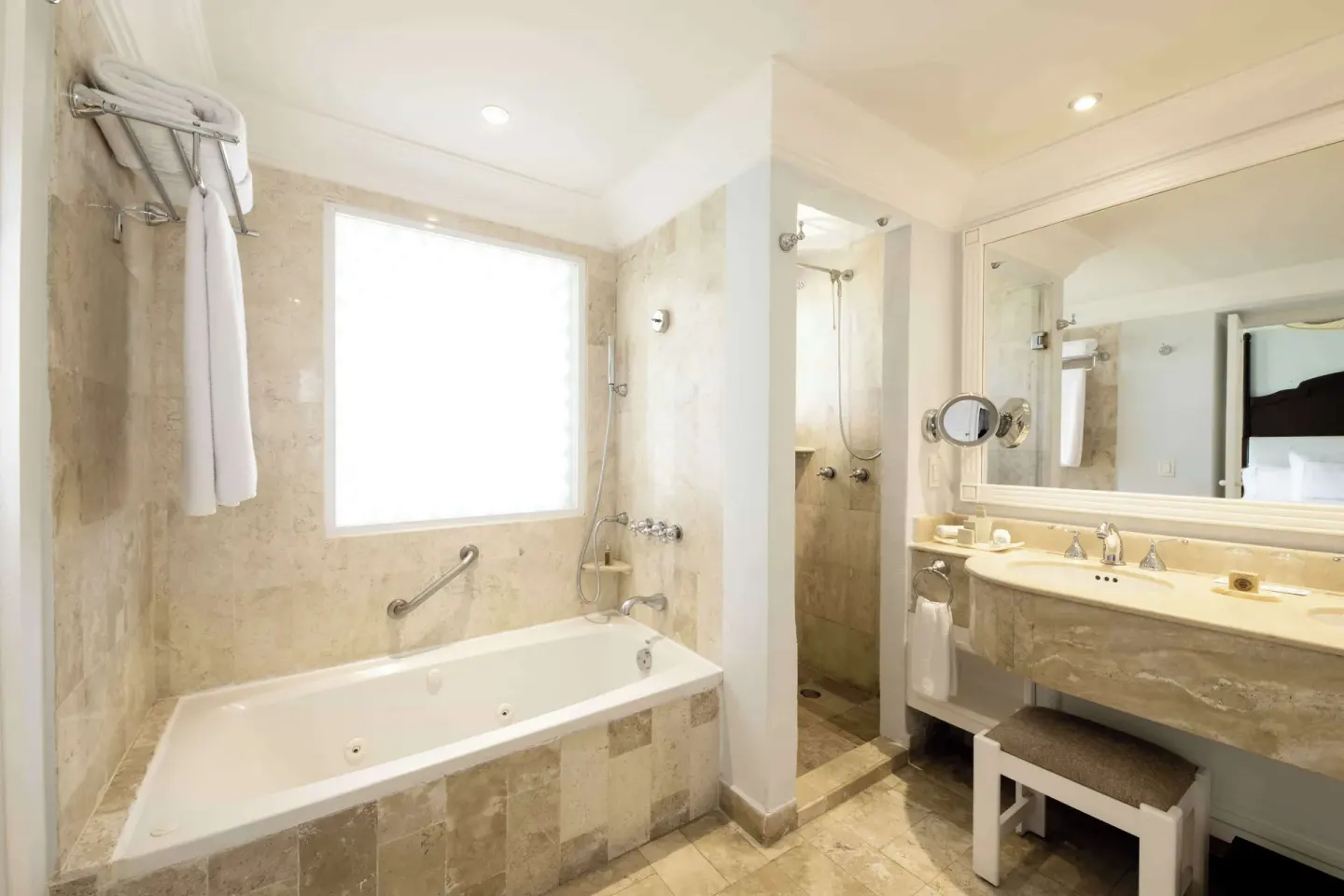 Luxury Room bathroom with tub, shower, and vanity at Royal Hideaway Playacar.