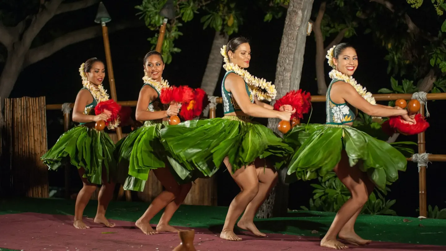 Hula dancers perform on an outdoor stage at Royal Kona Resort.