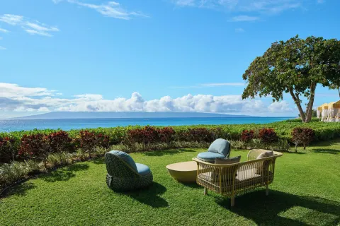 Oceanfront lawn seating with chairs and a sofa at Royal Lahaina Resort & Bungalows.