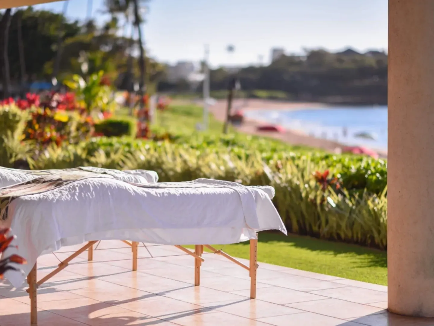 Outdoor massage table near tropical landscaping at Royal Lahaina Resort & Bungalows.