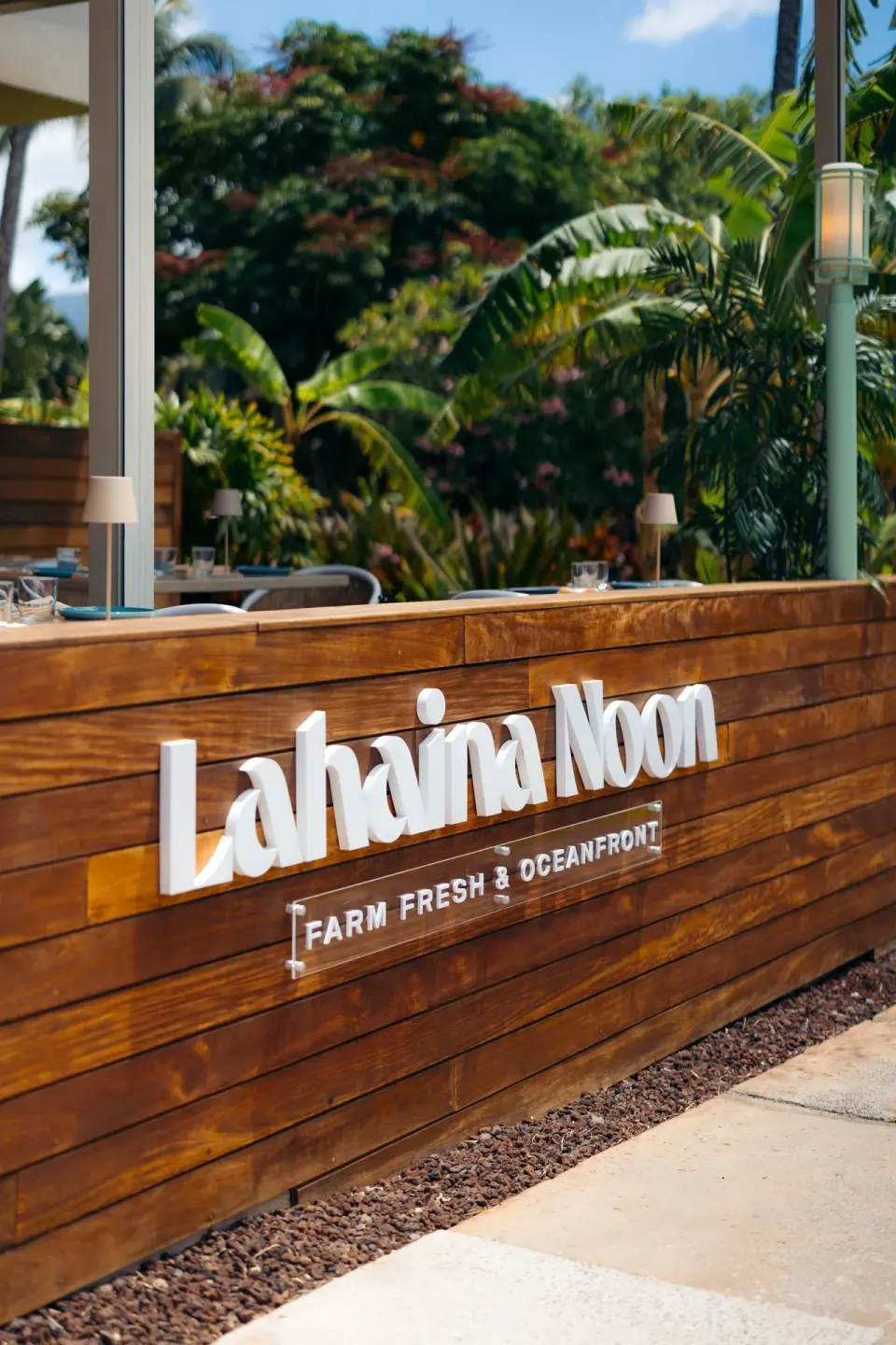 Lahaina Noon sign on a wood wall at Royal Lahaina Resort & Bungalows.