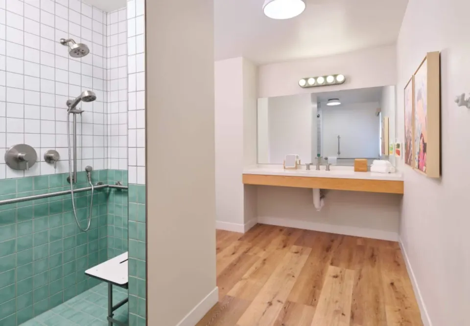 ADA bathroom with roll-in shower at Royal Lahaina Resort & Bungalows.