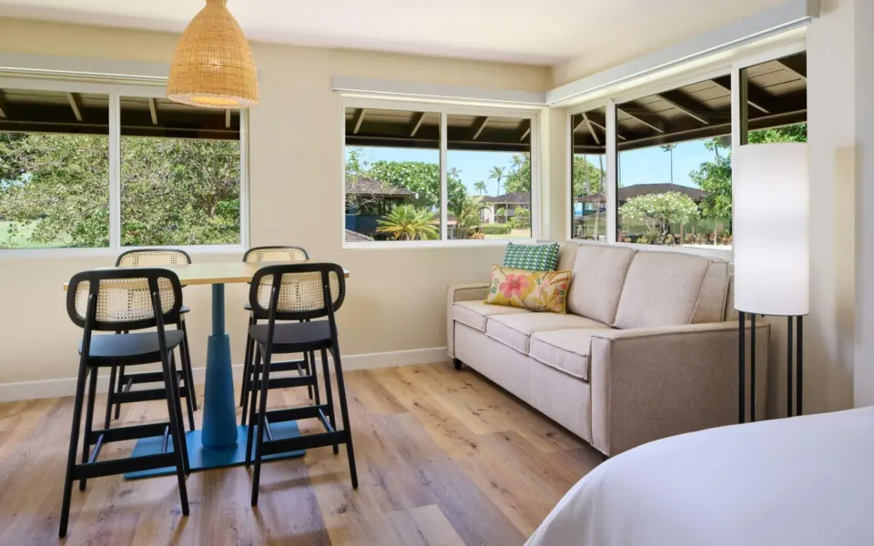 Sitting and dining area in a Bungalow Studio Suite with Kitchen at Royal Lahaina Resort & Bungalows.