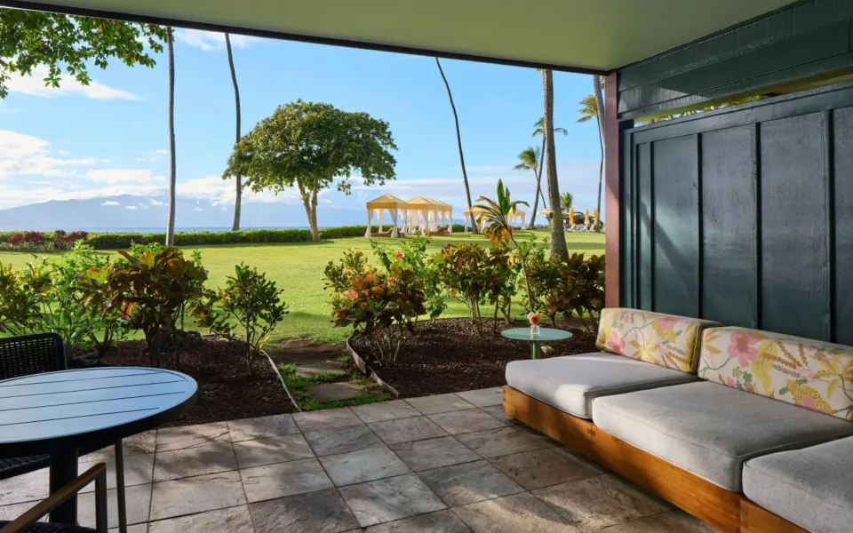 Bungalow Two lanai with seating and oceanfront lawn at Royal Lahaina Resort & Bungalows.