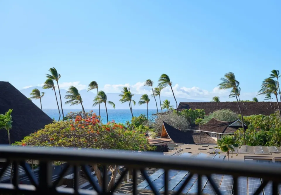 Partial ocean view with palms from Royal Lahaina Resort & Bungalows.