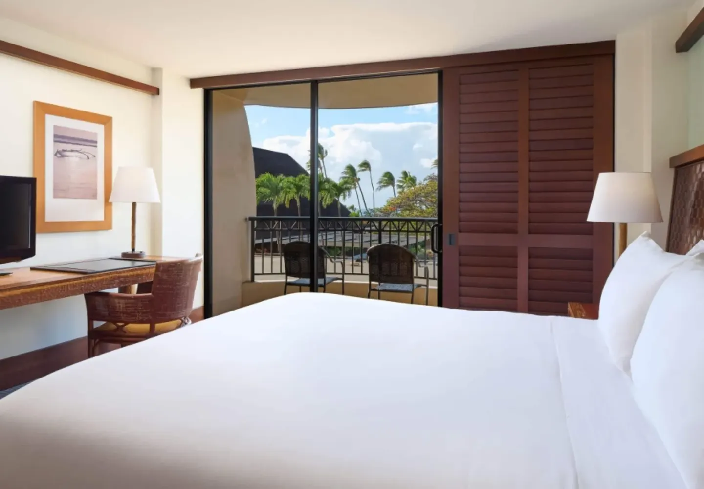 Partial Ocean View king bed and balcony at Royal Lahaina Resort & Bungalows.