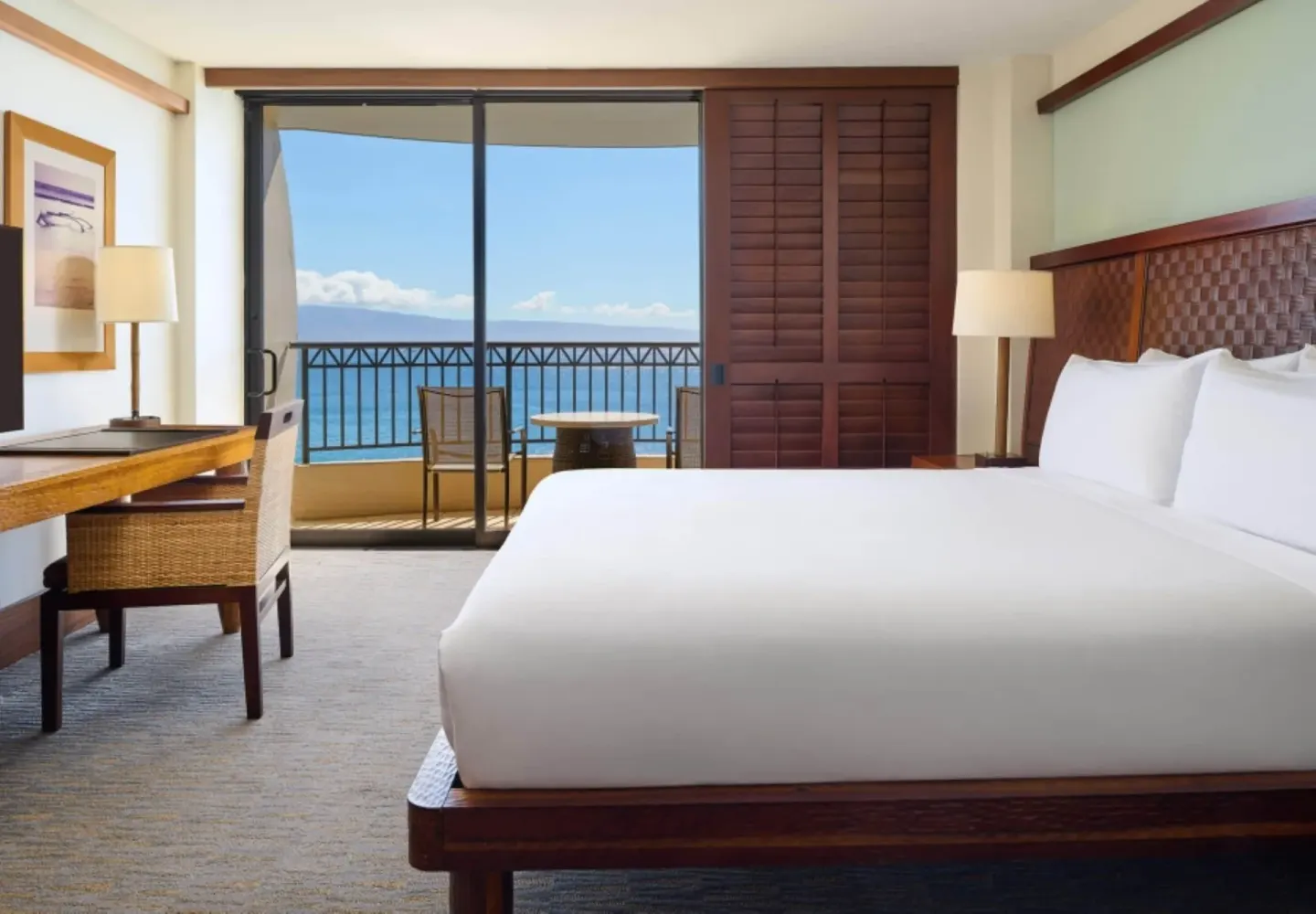 Premier Oceanfront One Bedroom Suite king bed with ocean balcony at Royal Lahaina Resort & Bungalows.