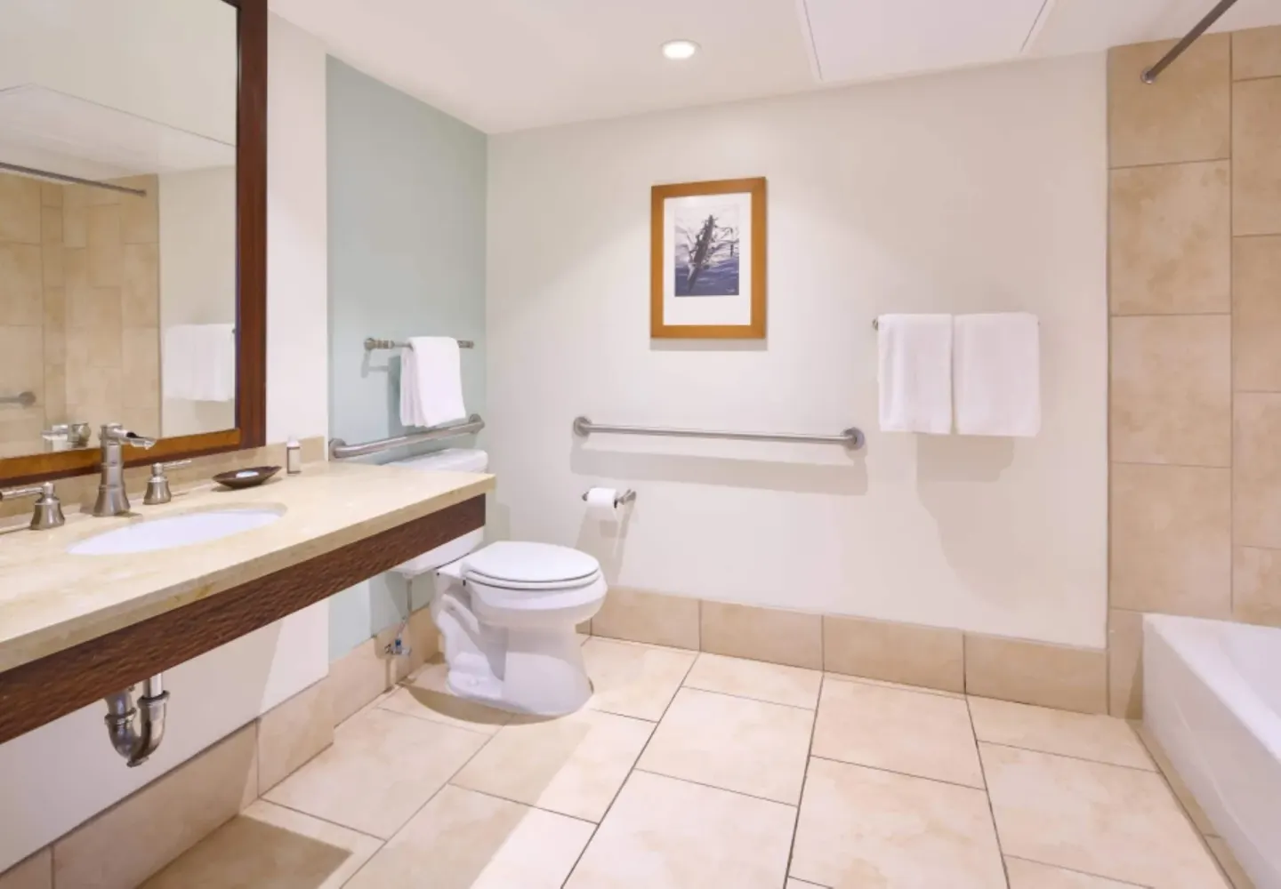 Accessible bathroom vanity and grab bars in a Resort View Two ADA room at Royal Lahaina Resort & Bungalows.