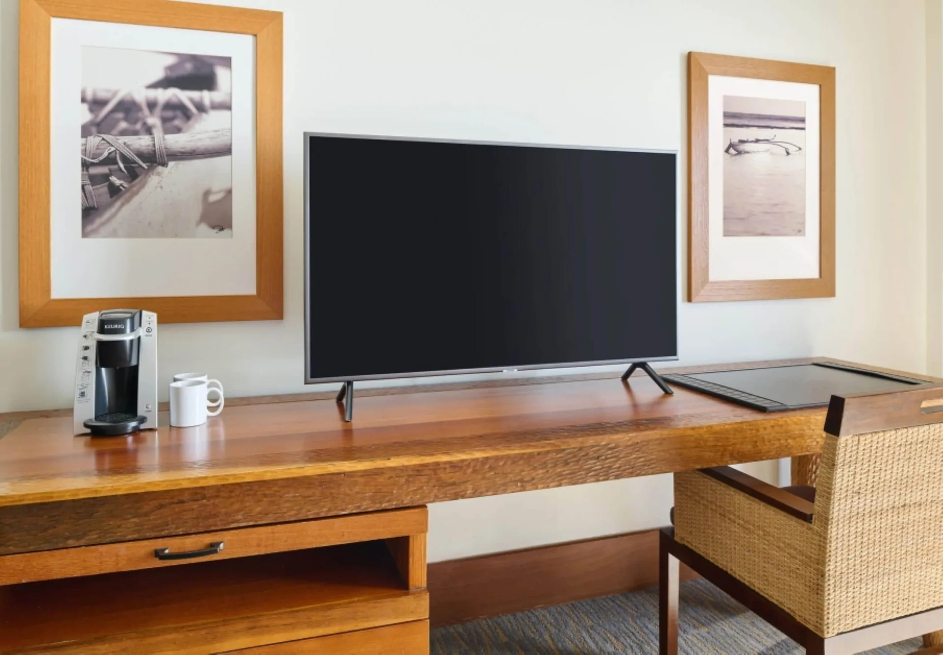 Desk, TV, and coffee maker in a Resort View Two ADA room at Royal Lahaina Resort & Bungalows.