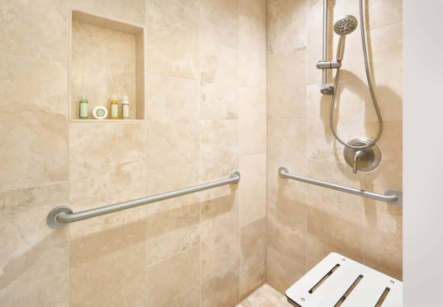 Roll-in shower with grab bars in a Resort View Two ADA room at Royal Lahaina Resort & Bungalows.