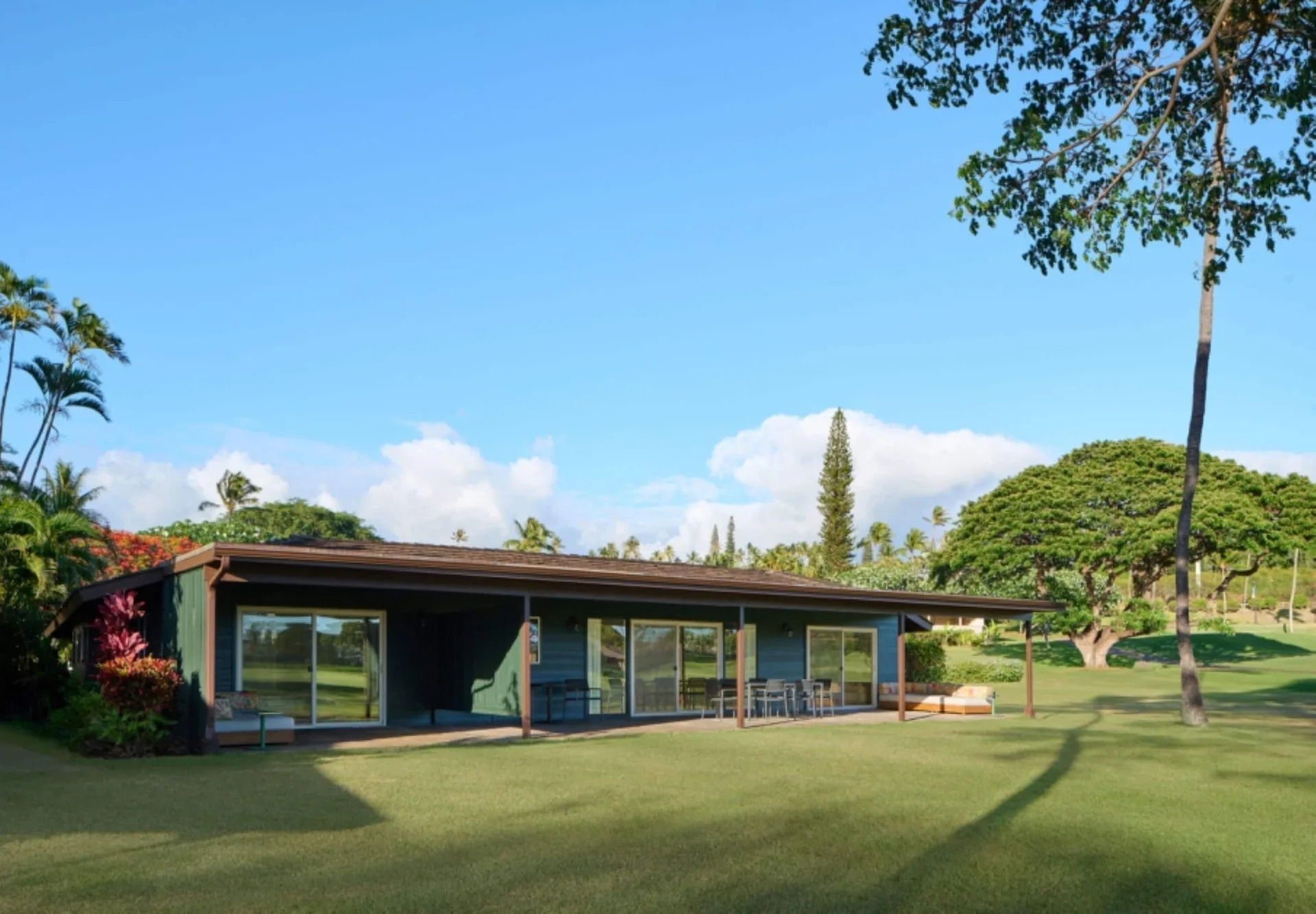 Exterior of a Royal Lahaina Resort & Bungalows on a lawn at Royal Lahaina Resort & Bungalows.
