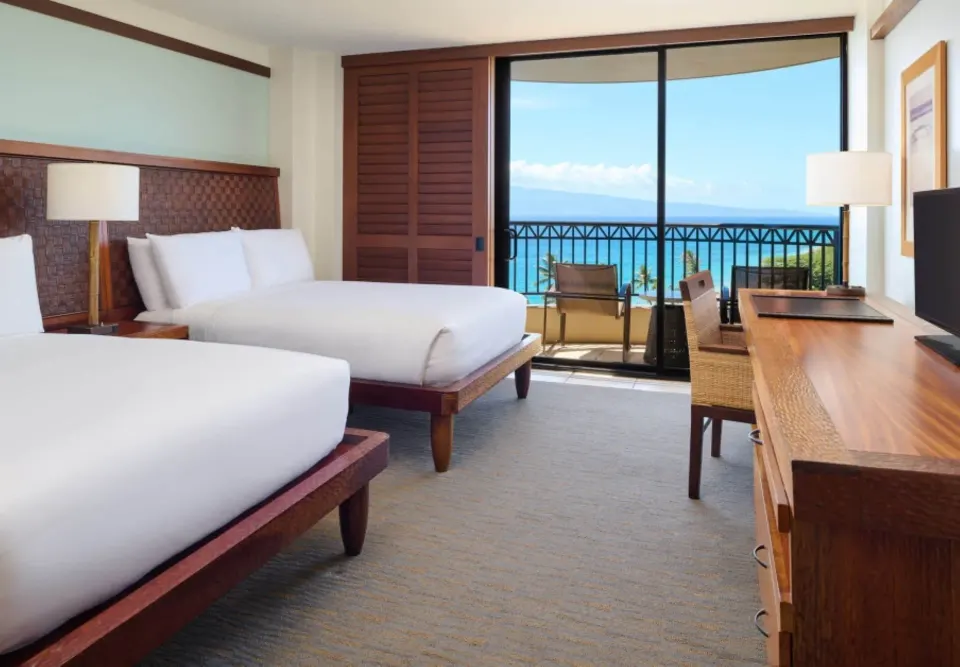 Tower Deluxe Ocean View room with two beds and balcony at Royal Lahaina Resort & Bungalows.