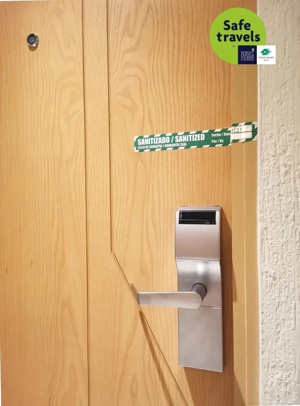 Guest room door with sanitized seal and handle at Royal Solaris Cancun.