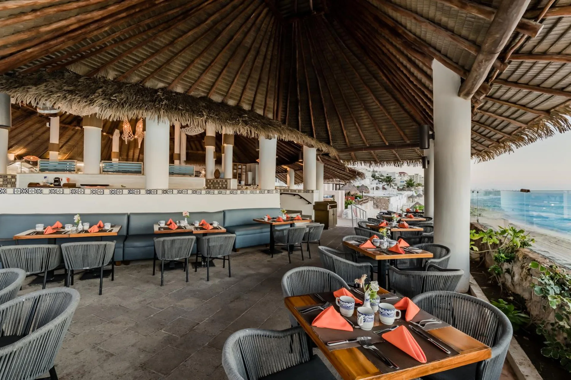 Beachfront palapa restaurant set for dining at Royal Solaris Cancun.
