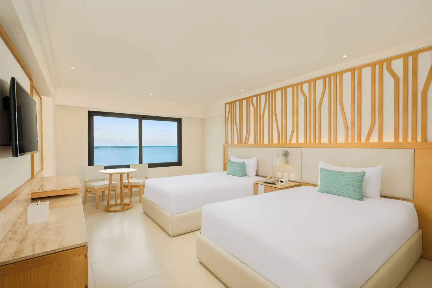 Deluxe Lagoon Room with two beds and lagoon view window at Royal Solaris Cancun.
