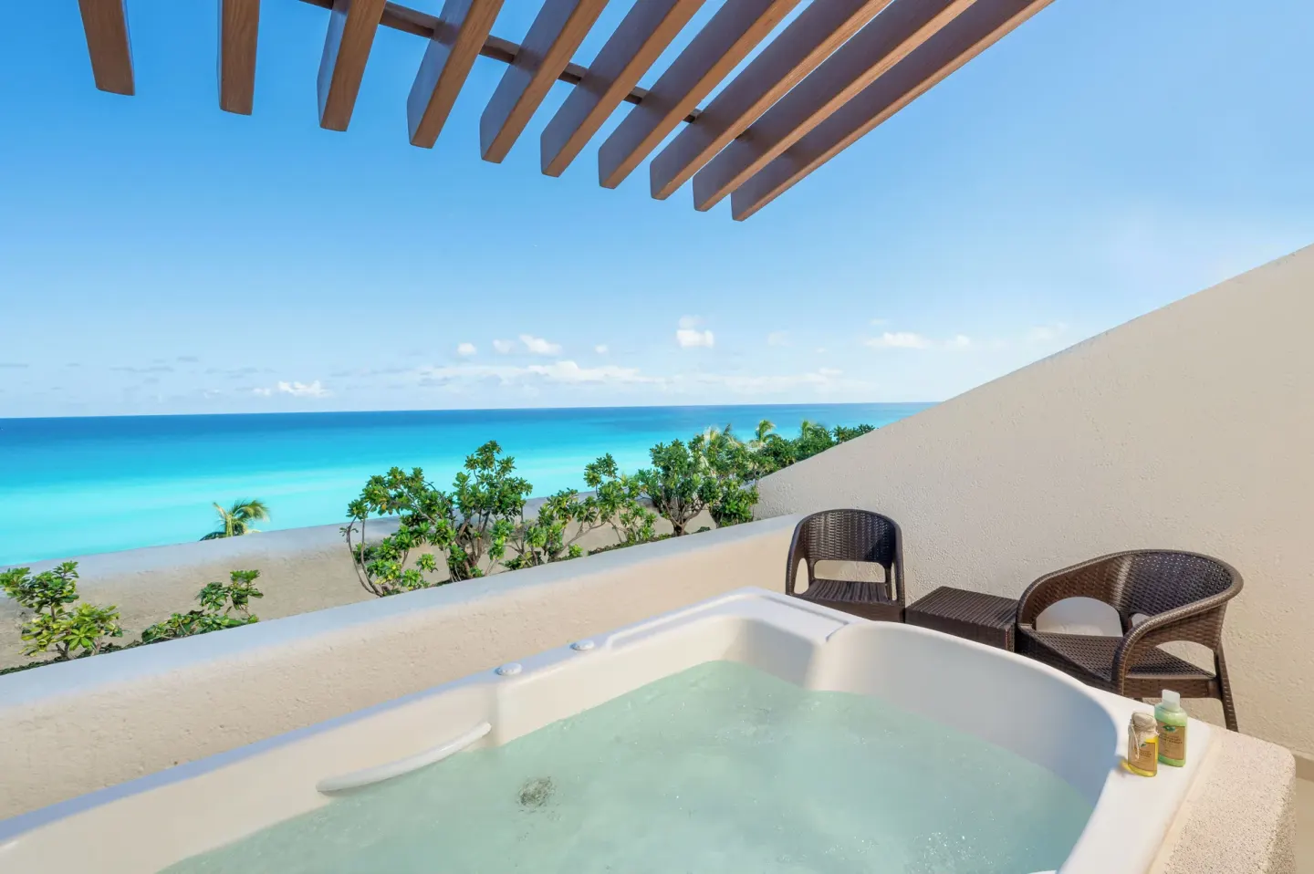 Ocean view terrace with jetted tub and seating at Royal Solaris Cancun.