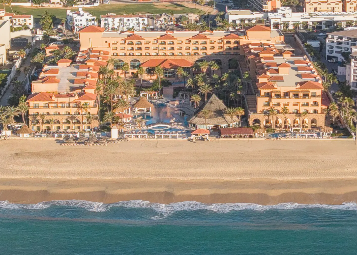 Aerial beachfront view of Royal Solaris Los Cabos & Spa with pools and sand.