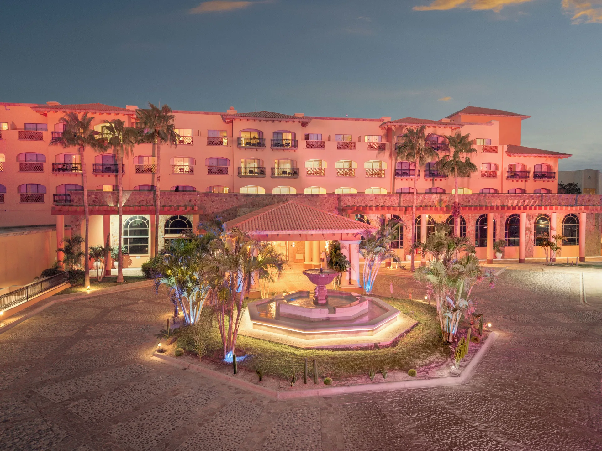 Illuminated entrance courtyard and fountain at Royal Solaris Los Cabos & Spa.