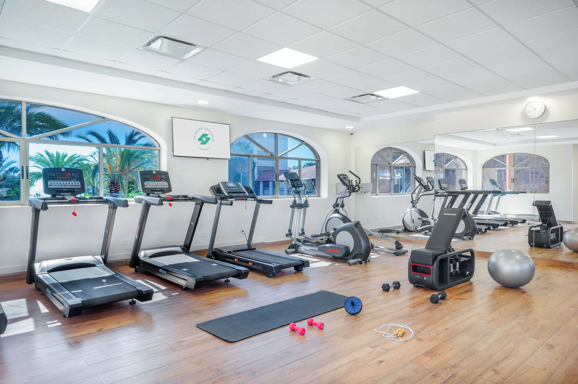 Fitness room with treadmills and exercise equipment at Royal Solaris Los Cabos & Spa.