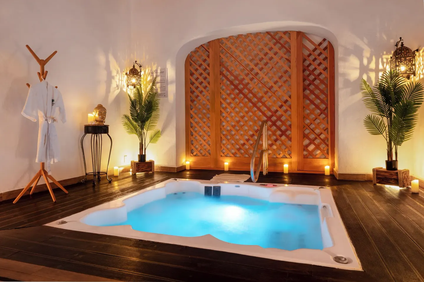 Candlelit spa soaking tub with plants and robes at Royal Solaris Los Cabos & Spa.
