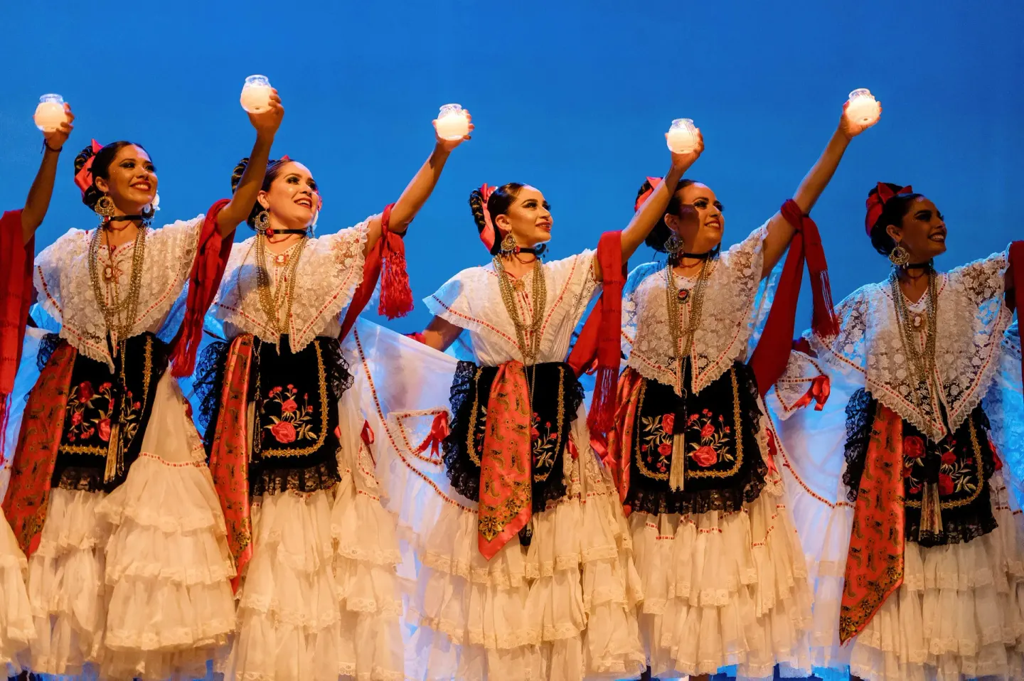 Dancers in traditional costumes perform on stage at Royal Solaris Los Cabos & Spa.