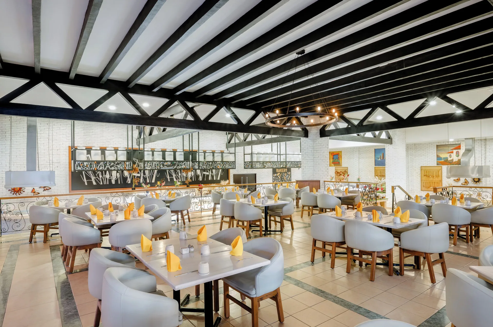 Bright dining room with set tables at Royal Solaris Los Cabos & Spa.