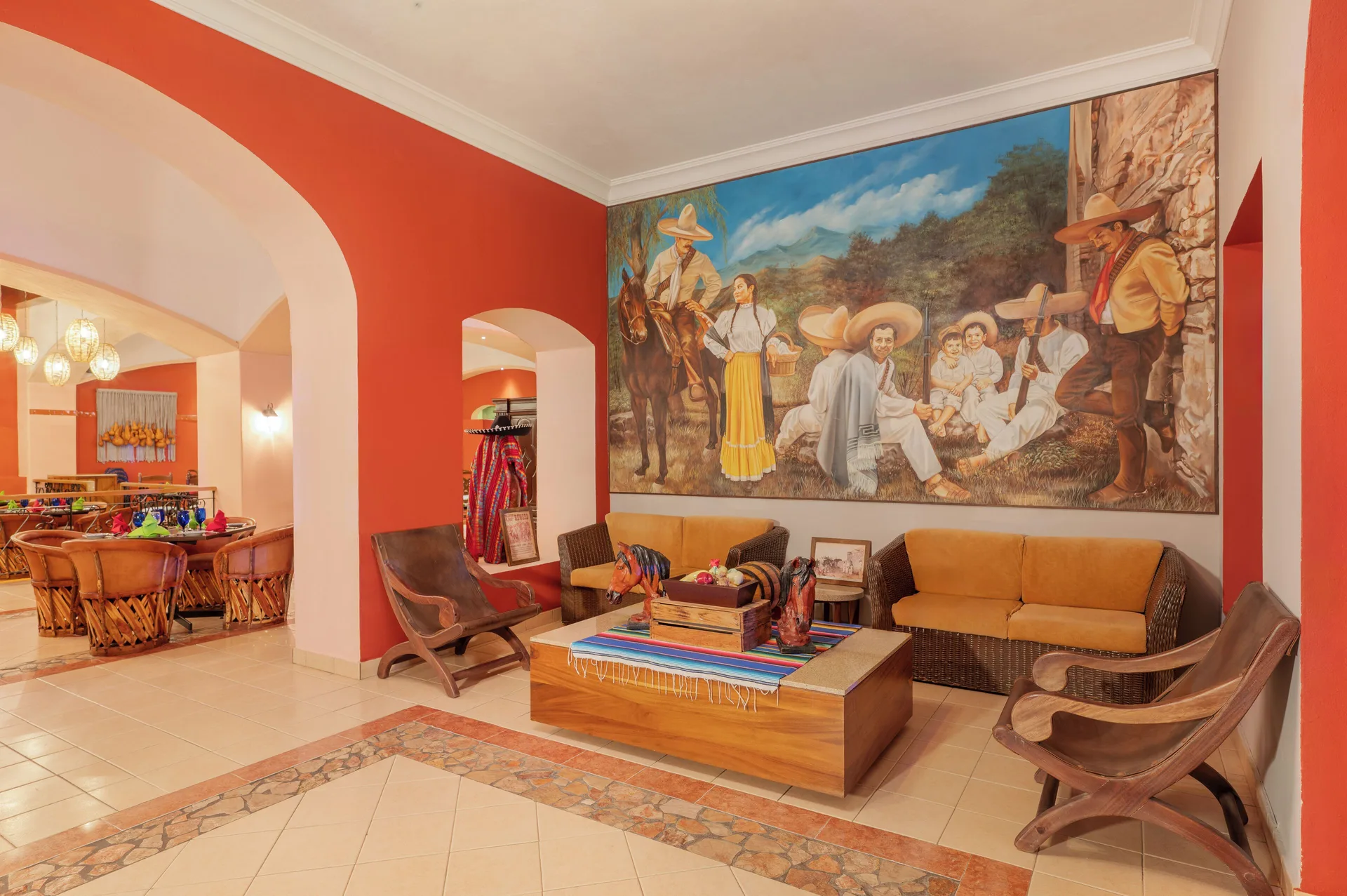 Mexican-themed lounge beside a dining area at Royal Solaris Los Cabos & Spa.