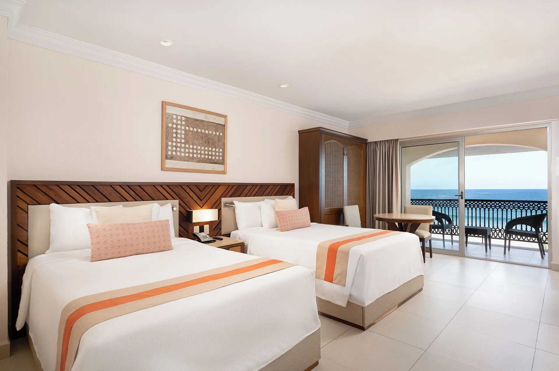 Deluxe Oceanfront room with two beds and balcony at Royal Solaris Los Cabos & Spa.